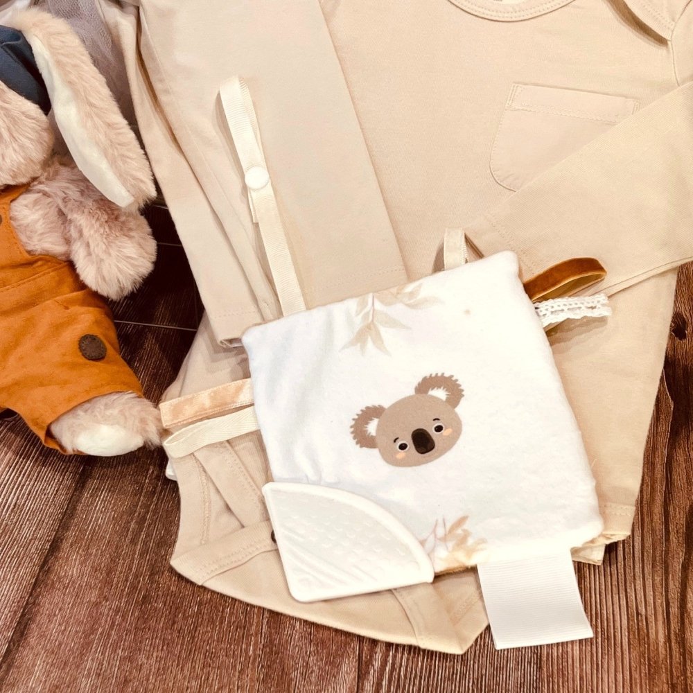 Thoughtfully curated gift box with organic baby clothing