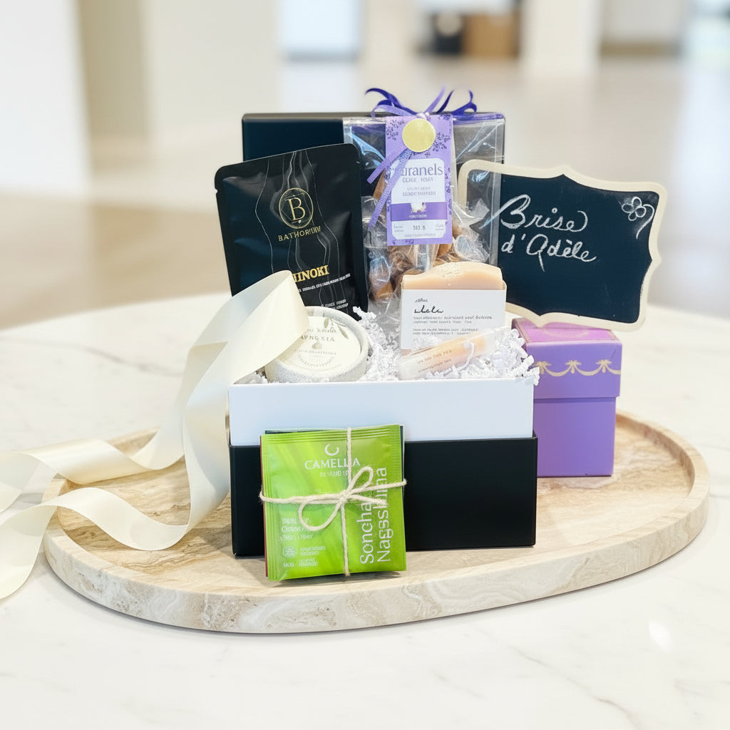 gift box with bath salts, handmade caramels, handmade soap, ceramic pot candle, vegan lip balm and Japanese teas.