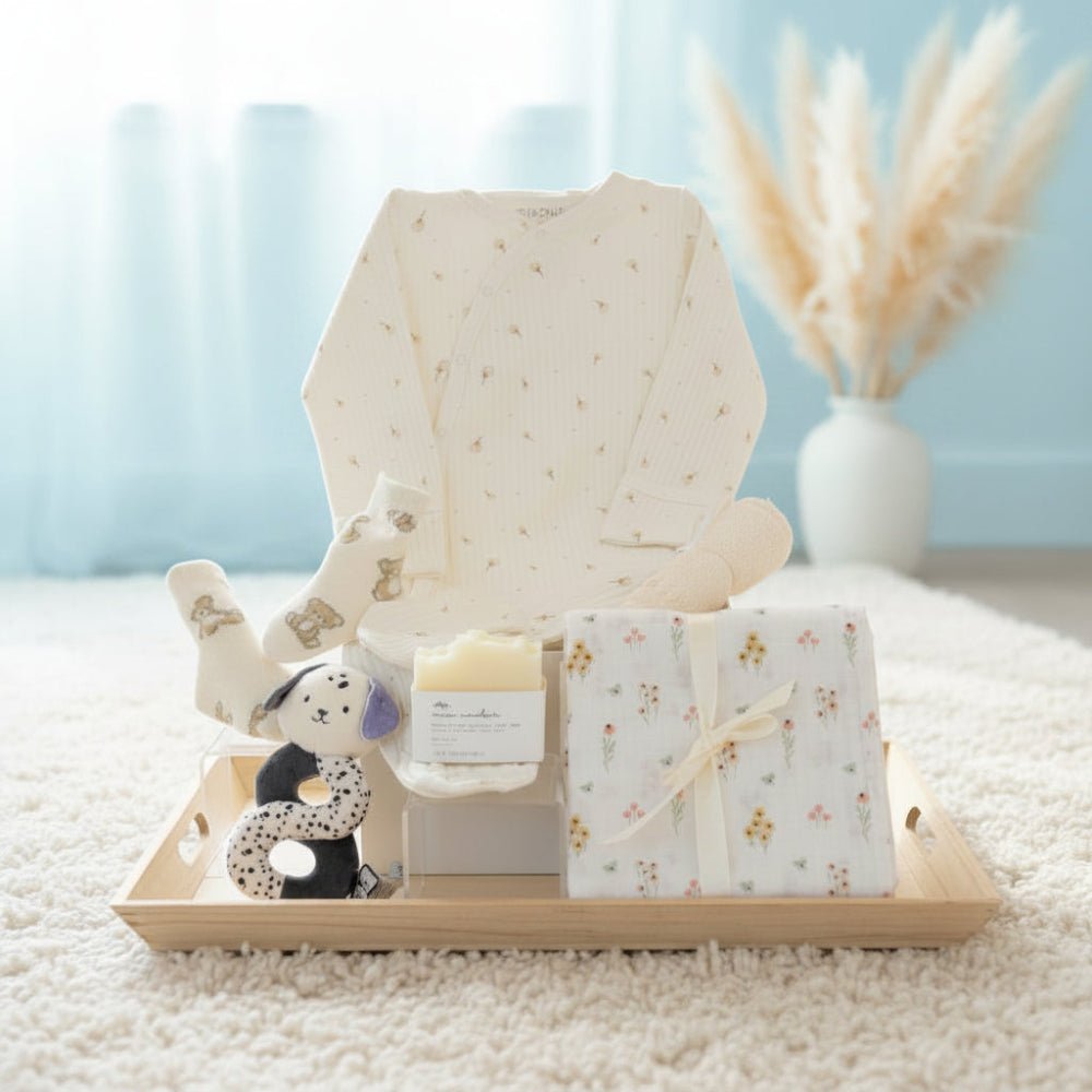baby gift with socks, swaddle blanket, baby soap, Kaloo plush toy, bambou washcloth, wrap around bodysuit organic cotton.