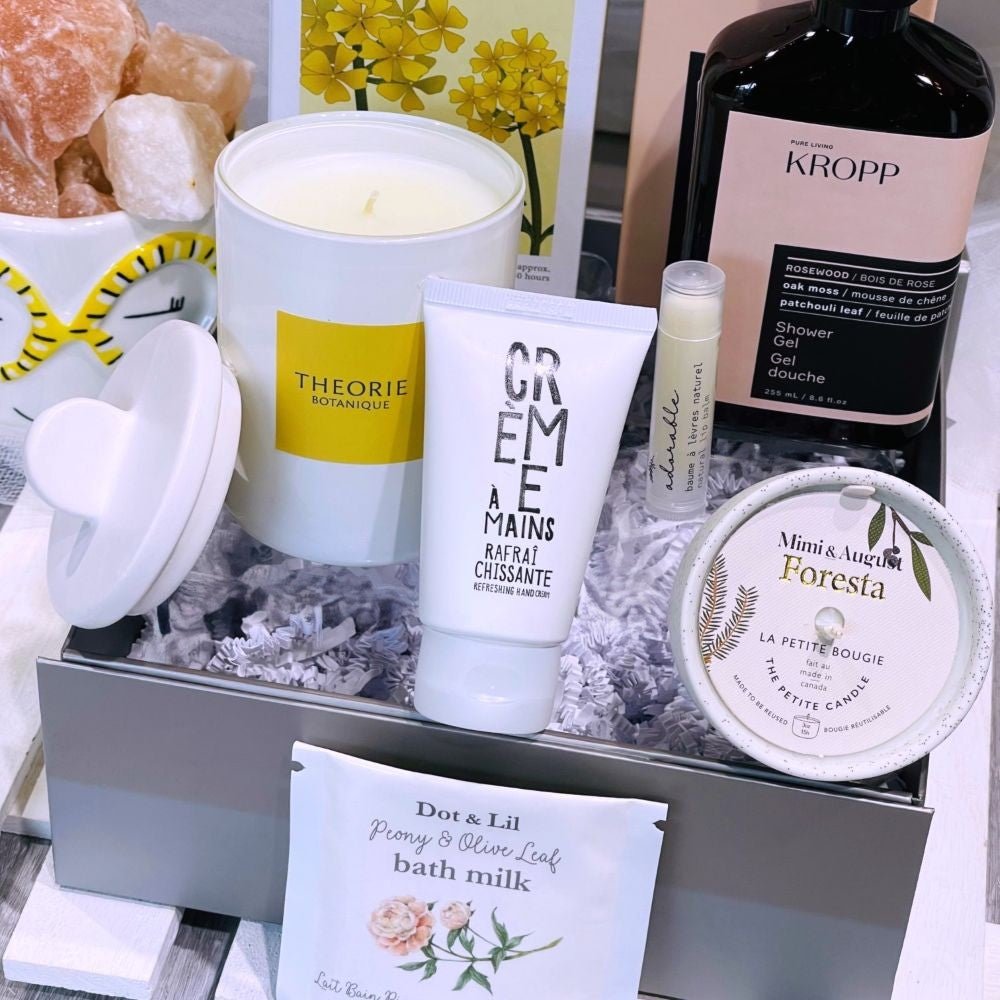 care package with beautiful candle and self care articles