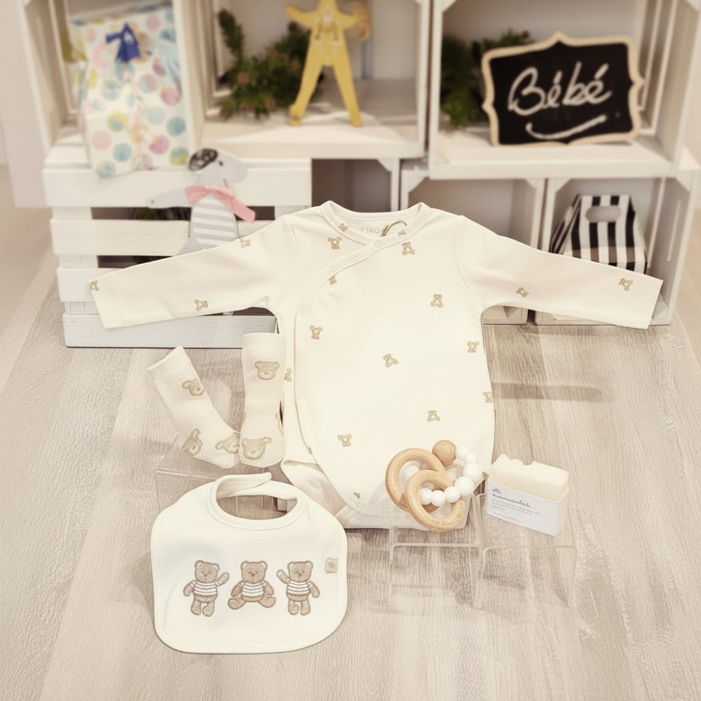 baby gift with organic cotton bodysuit, bib, socks, baby soap and wooden teether