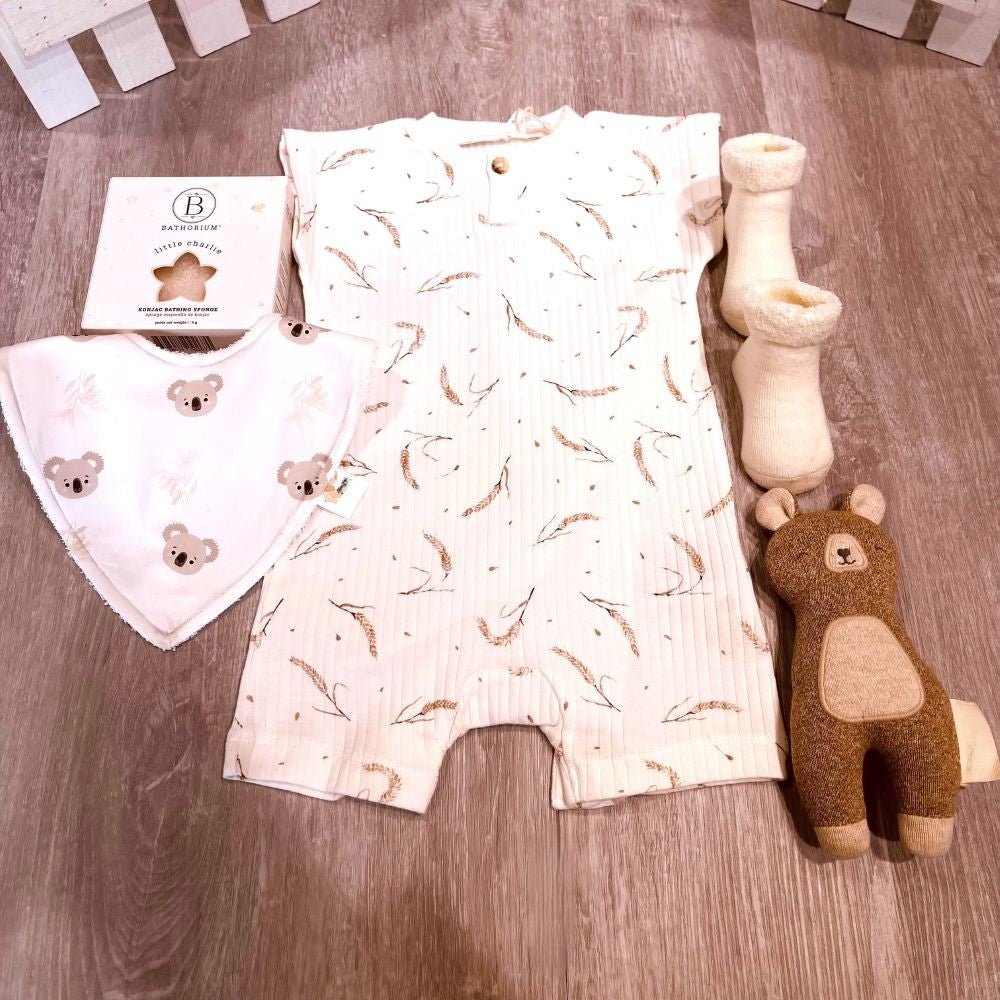 "Sweet Trésor curated baby gift box featuring adorable and charming accessories."