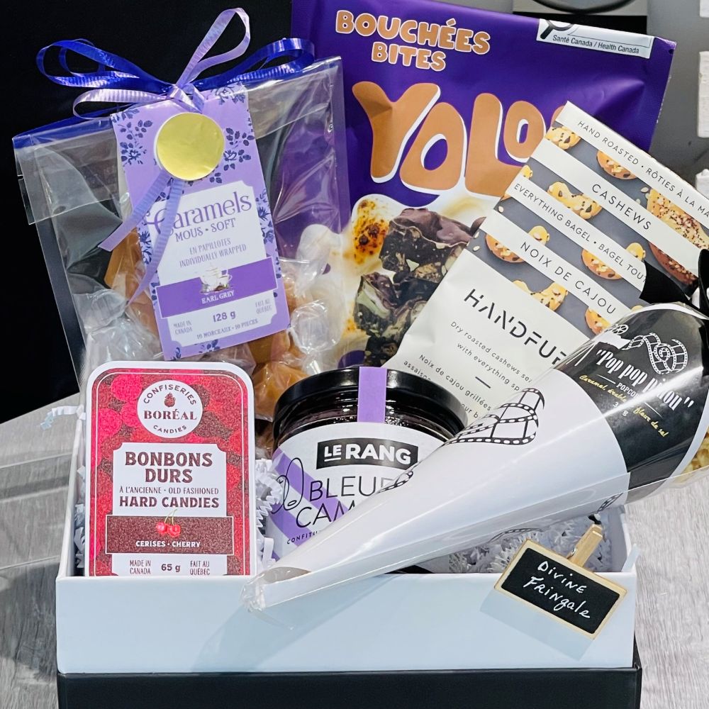 curated gift with popcorn, soft caramels with fleur de sel, hard home made candies, all bagel nuts and blueberry spread